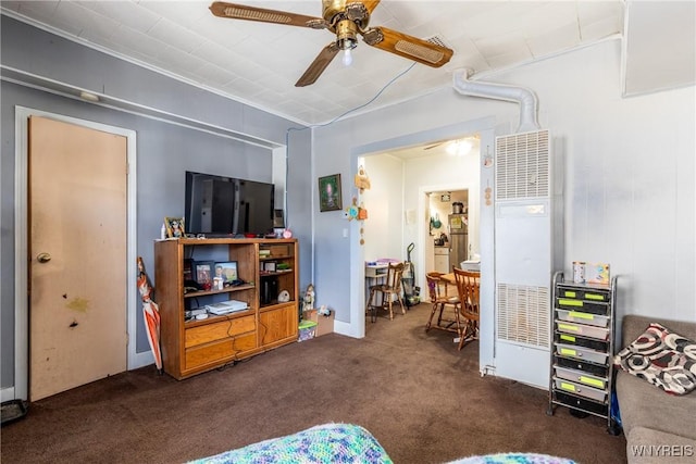 interior space with dark carpet and ceiling fan