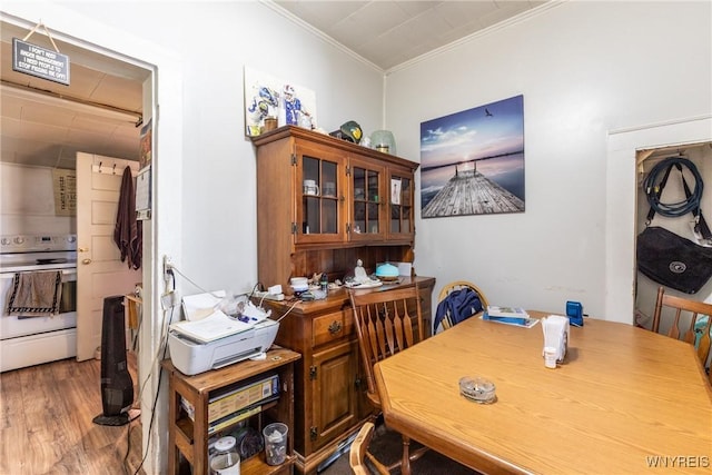 office area with crown molding and wood finished floors