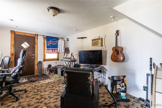 office with a textured ceiling and a wall mounted air conditioner