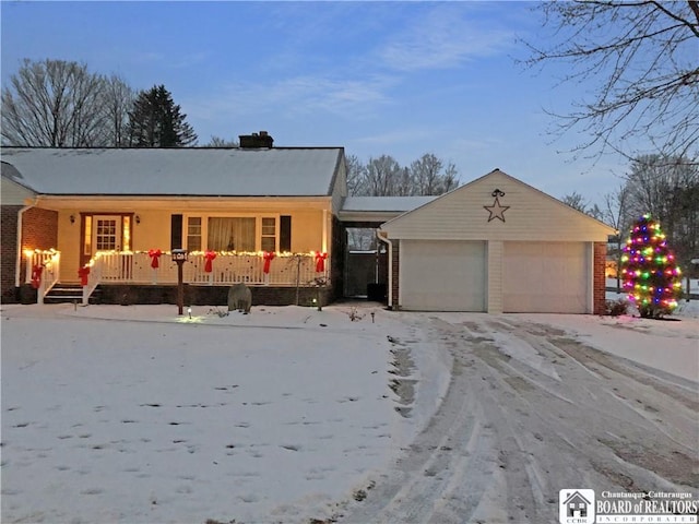 ranch-style house with covered porch, brick siding, and a garage