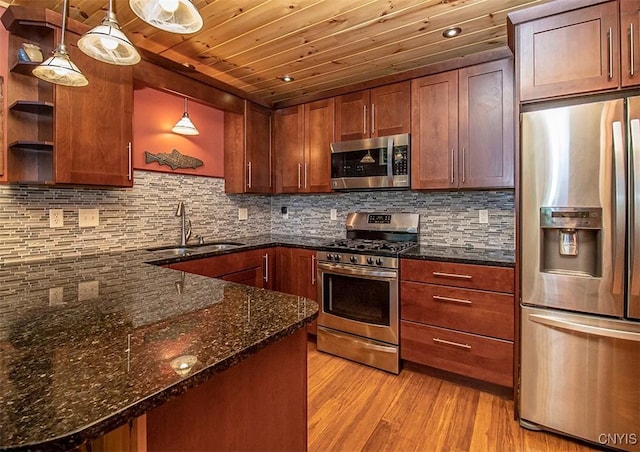 kitchen featuring open shelves, stainless steel appliances, decorative backsplash, a sink, and light wood-type flooring