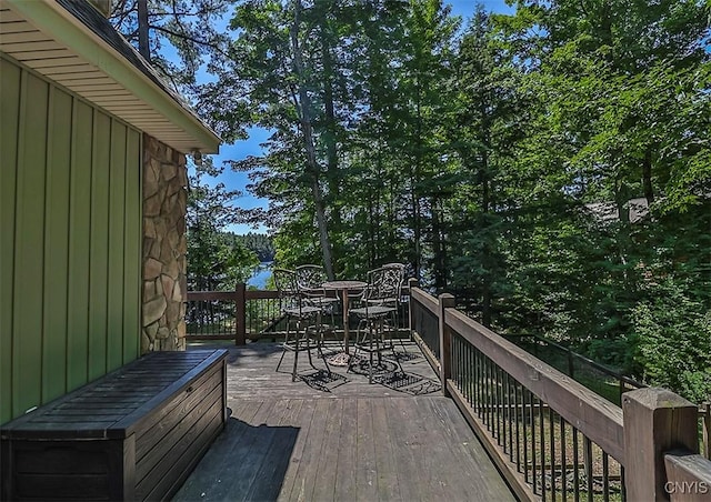 wooden deck featuring outdoor dining space