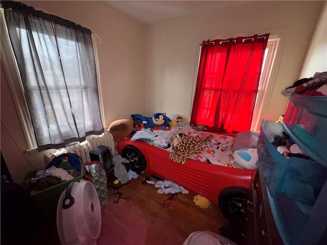 bedroom with wood finished floors