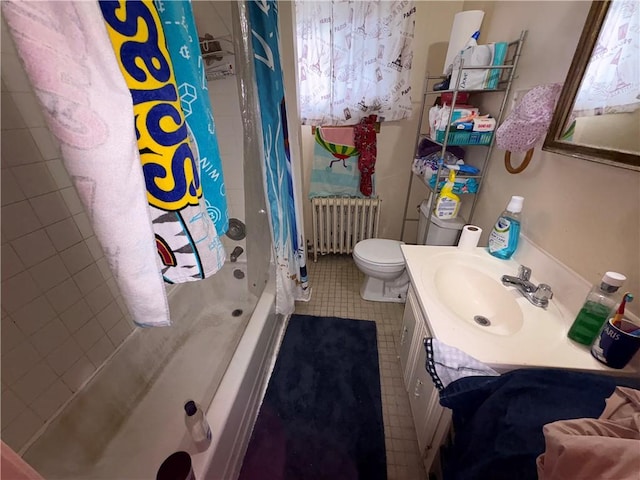 bathroom featuring shower / tub combo, radiator, vanity, and toilet