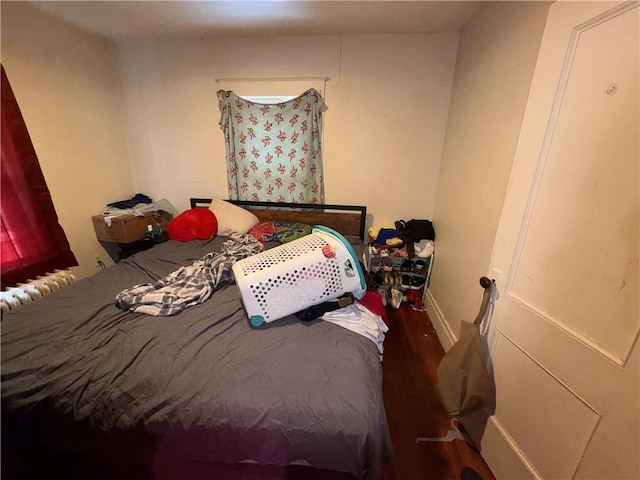 bedroom with wood finished floors