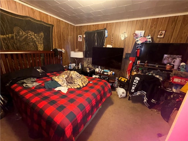 bedroom featuring carpet floors and wood walls