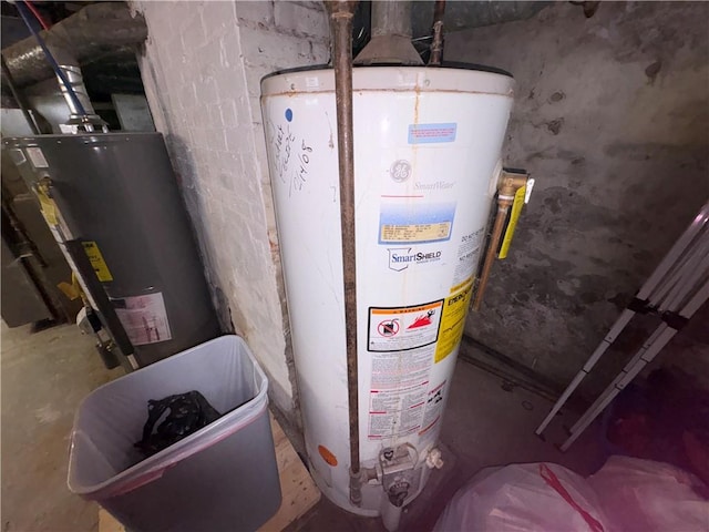 utility room featuring gas water heater