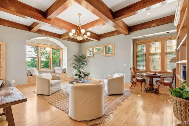 living room with light wood-style flooring, coffered ceiling, and beamed ceiling