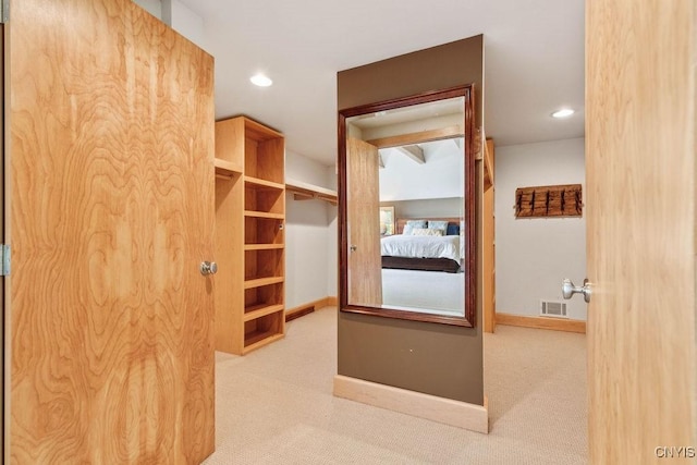 walk in closet featuring visible vents and carpet flooring