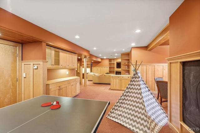 recreation room featuring a wainscoted wall and recessed lighting