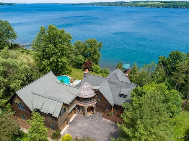 birds eye view of property with a water view