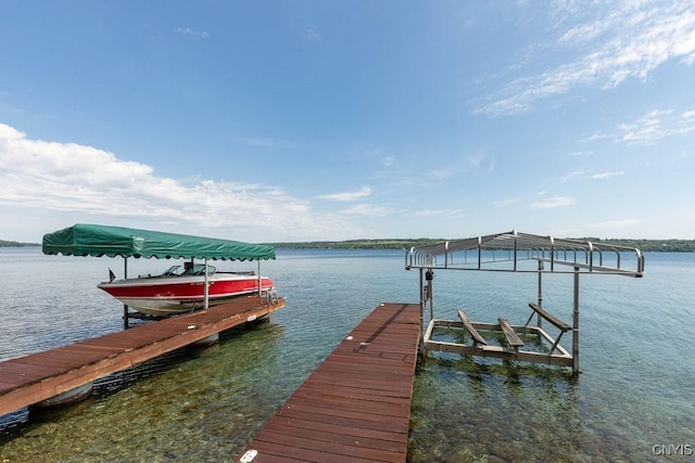 dock area with a water view and boat lift