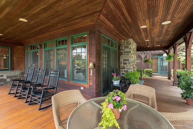 view of patio / terrace with a porch and outdoor dining area