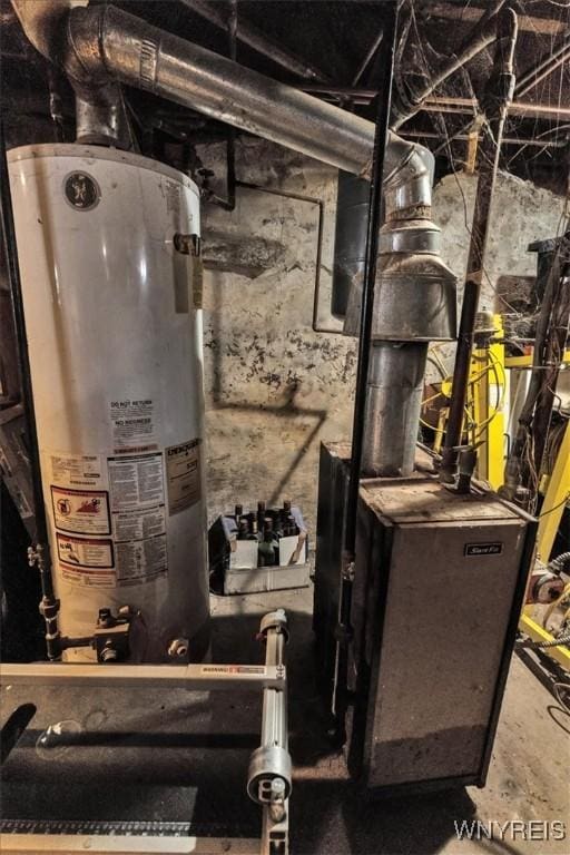 utility room featuring water heater