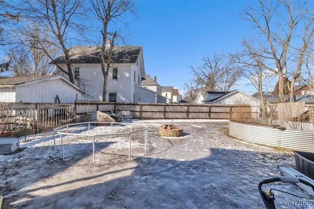 view of yard with an outdoor fire pit and a fenced backyard