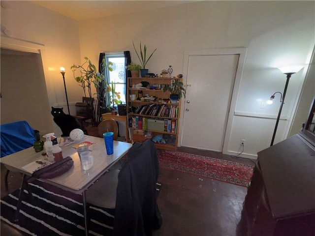 dining room featuring concrete flooring