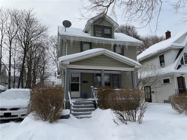 traditional style home featuring covered porch