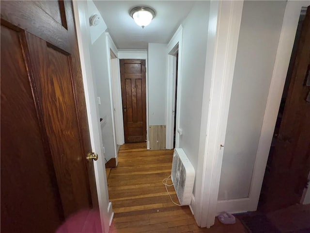 corridor featuring visible vents and wood finished floors