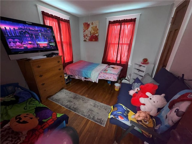 bedroom featuring wood finished floors