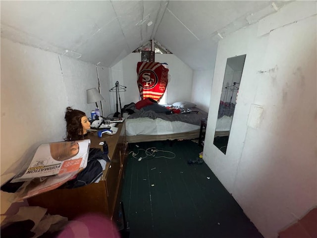 bedroom with lofted ceiling