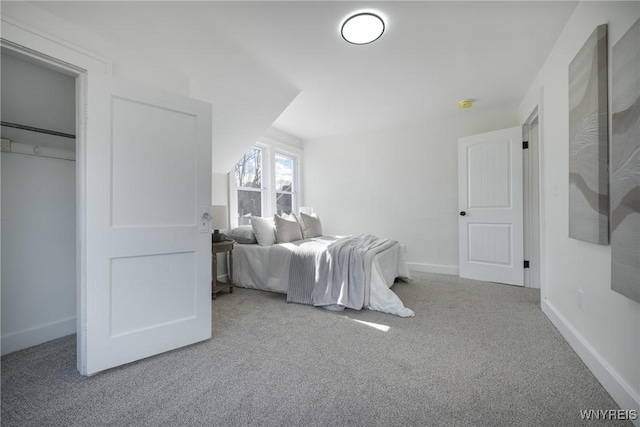 carpeted bedroom with baseboards