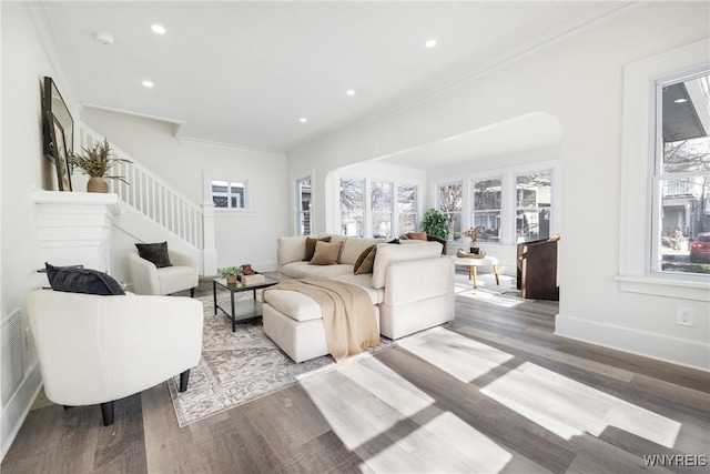 living area featuring stairway, baseboards, wood finished floors, and recessed lighting