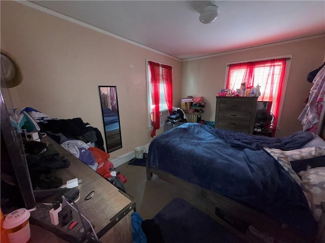 bedroom with baseboards and ornamental molding