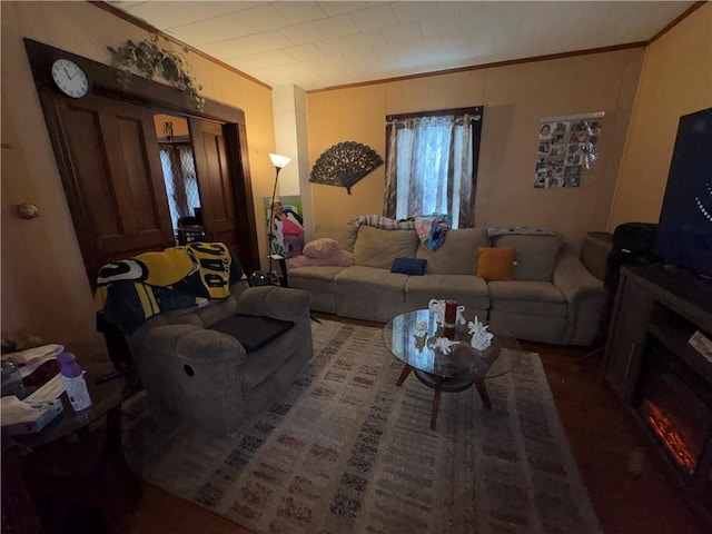 living room with wooden walls and ornamental molding