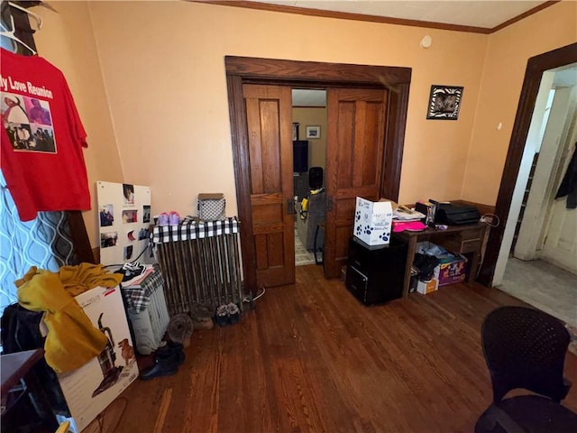 interior space featuring ornamental molding and wood finished floors