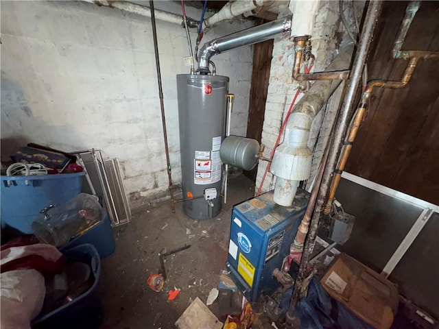 utility room featuring water heater