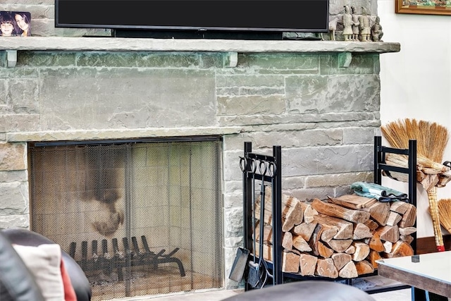 room details featuring a stone fireplace