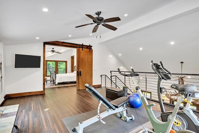 exercise area featuring lofted ceiling, a barn door, recessed lighting, wood finished floors, and a ceiling fan