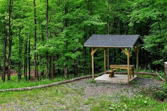 view of yard with a wooded view