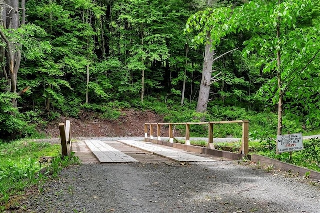 exterior space with a wooded view