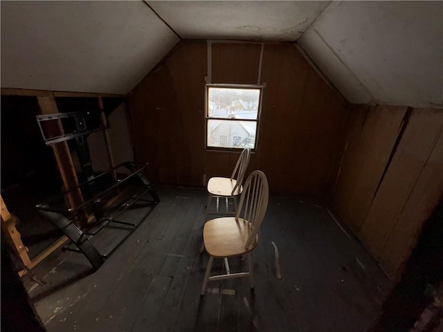 additional living space featuring lofted ceiling and hardwood / wood-style floors