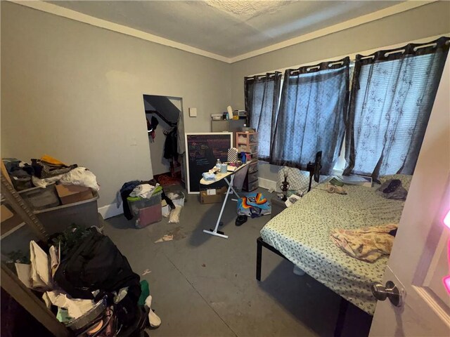 bedroom with concrete floors