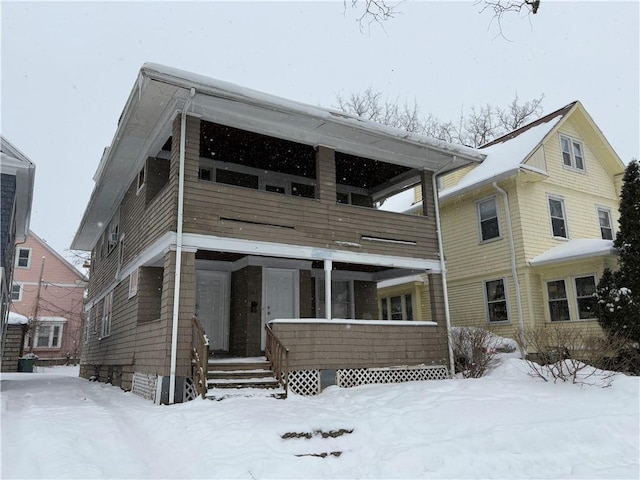 view of front of house featuring a balcony