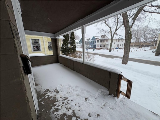 unfurnished sunroom featuring a residential view