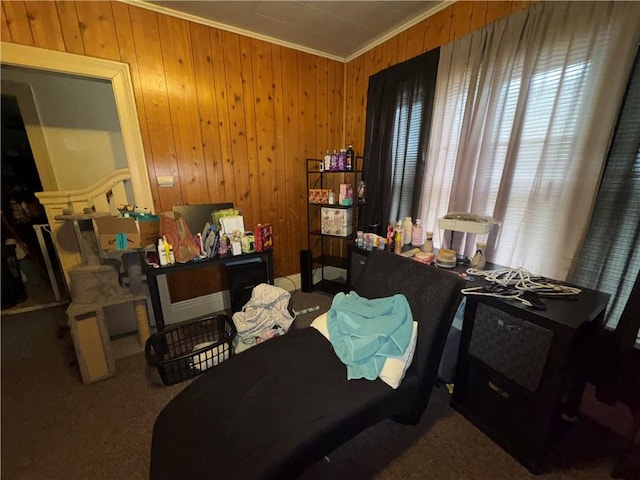 bedroom featuring ornamental molding and wood walls