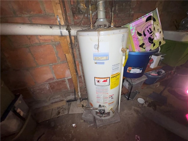 utility room with gas water heater