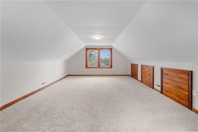 bonus room with carpet floors, a baseboard radiator, baseboards, and vaulted ceiling