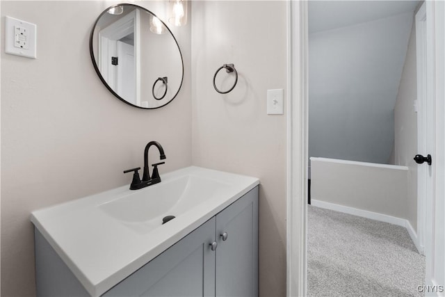 bathroom featuring baseboards and vanity