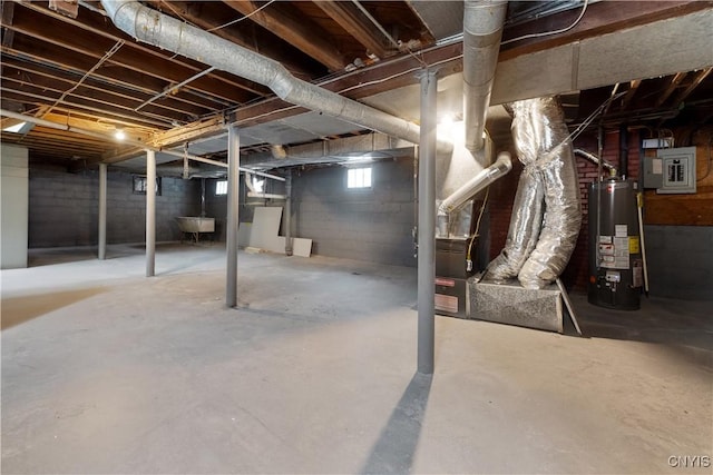 basement featuring gas water heater, electric panel, and a sink