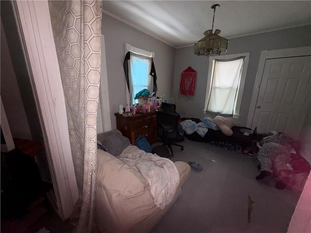 bedroom with ornamental molding and multiple windows