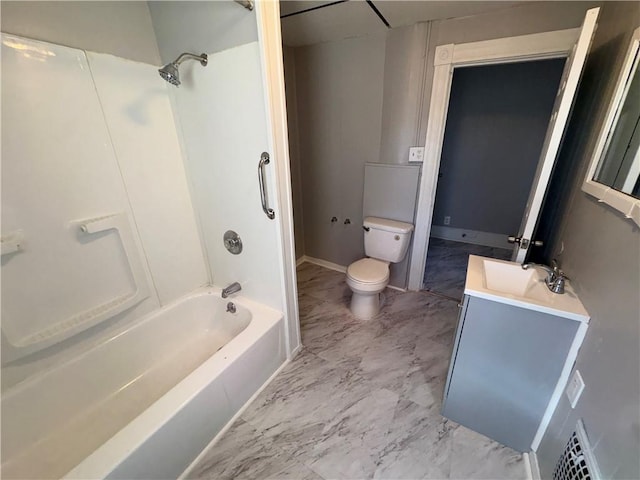 bathroom featuring toilet, visible vents, vanity, marble finish floor, and washtub / shower combination