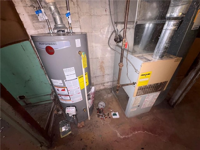 utility room featuring heating unit and gas water heater