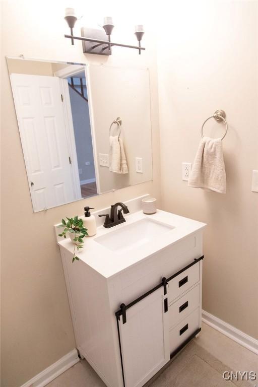 bathroom featuring vanity and baseboards