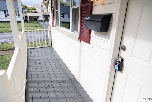 wooden deck with a residential view