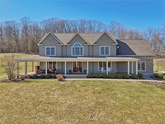 view of front facade featuring a front yard and covered porch