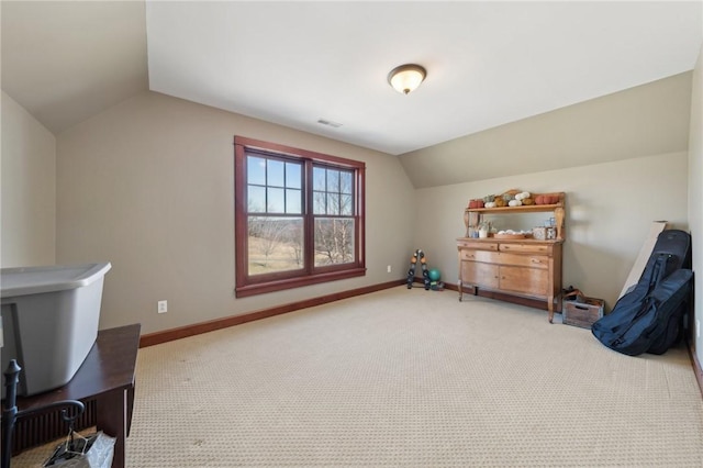 bonus room with lofted ceiling, visible vents, light colored carpet, and baseboards